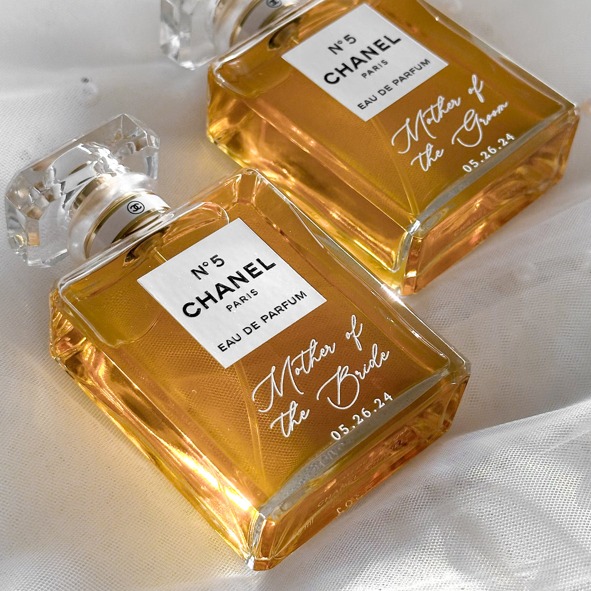 Perfume bottles personalized with Mother of the Bride in white script lettering