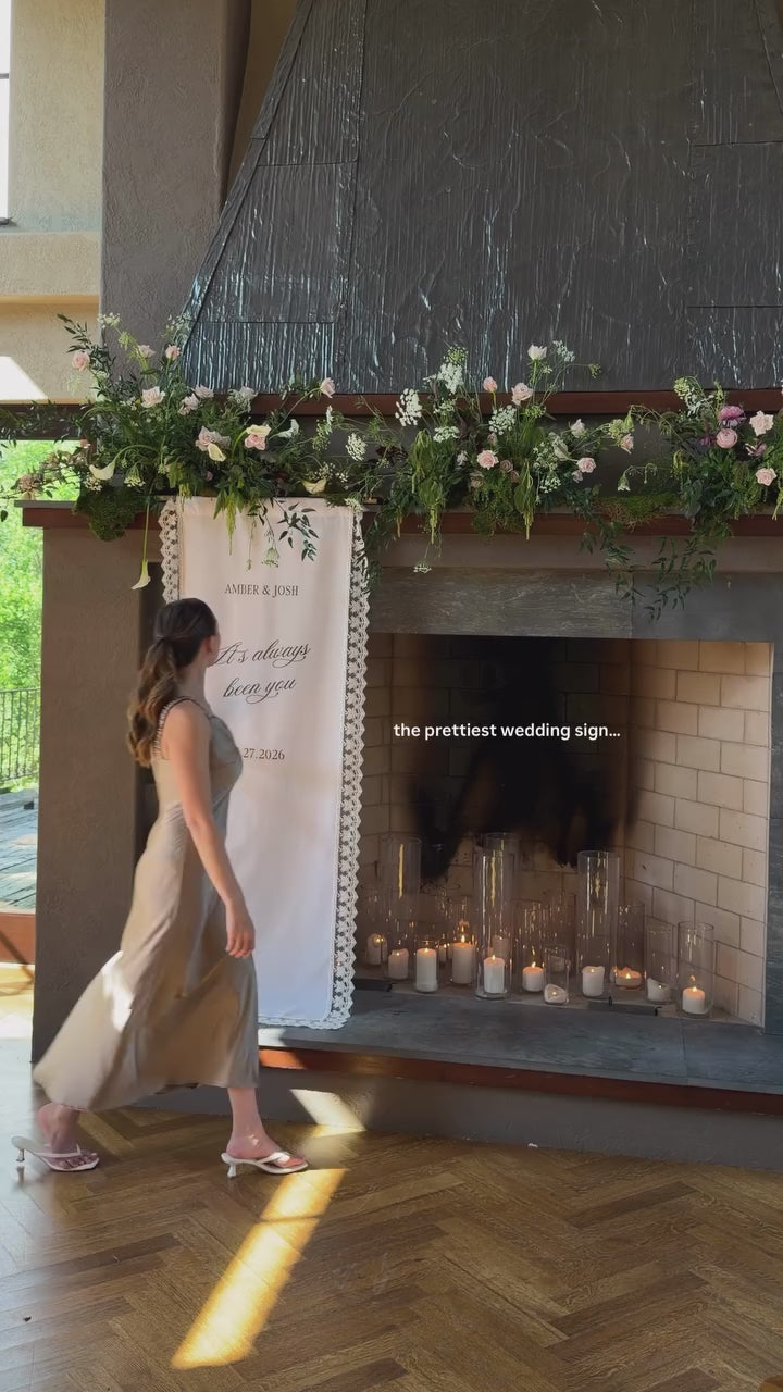 Linen and lace wedding welcome sign on a mantel